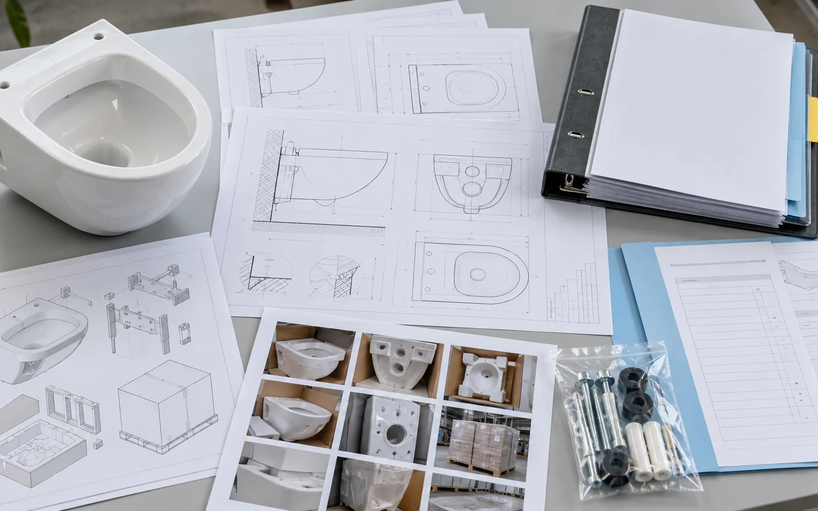 technical drawings approval records and wall hung toilet sample arranged for document control